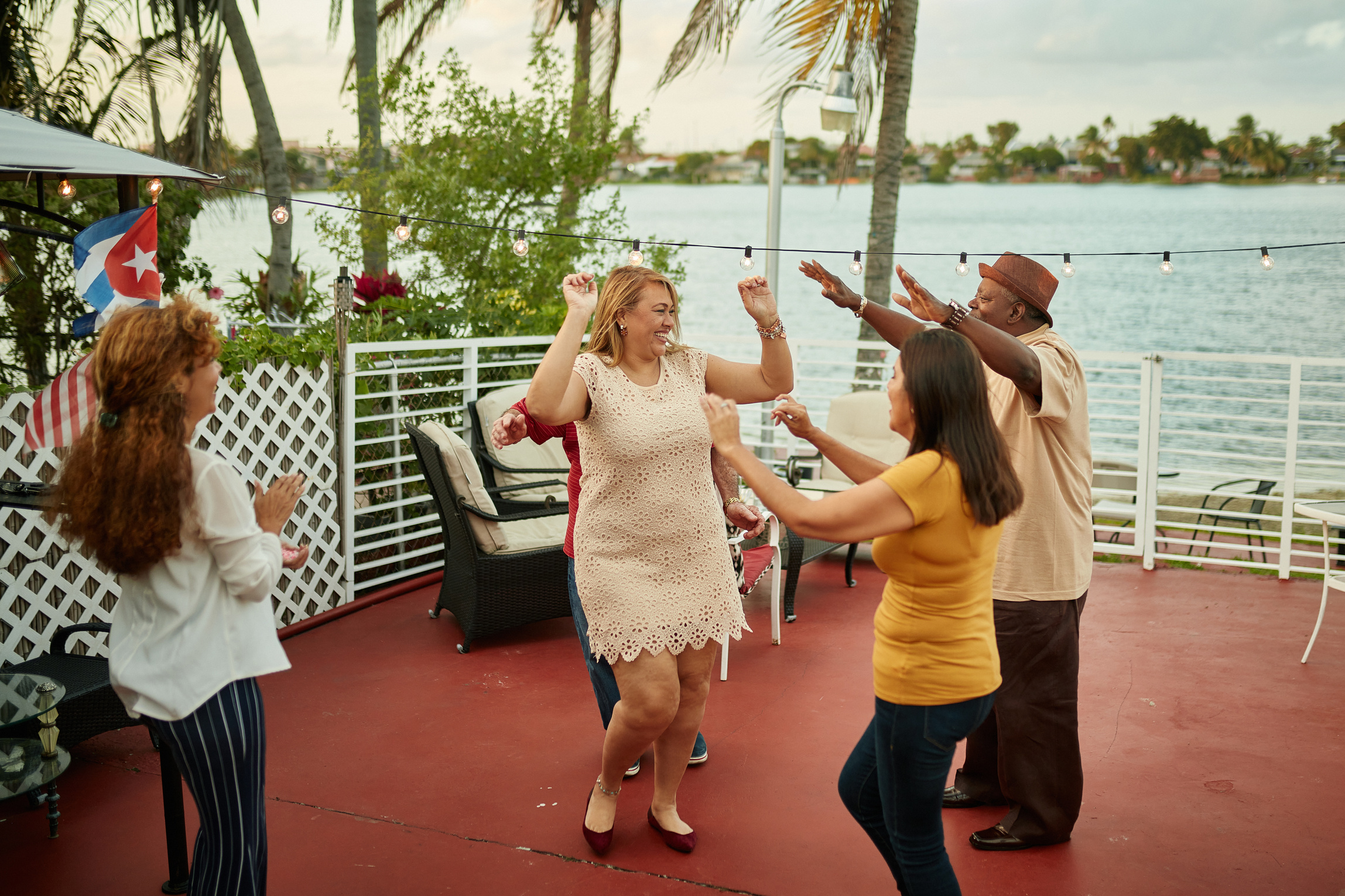 Smiling Hispanic and African-American Friends Dancing